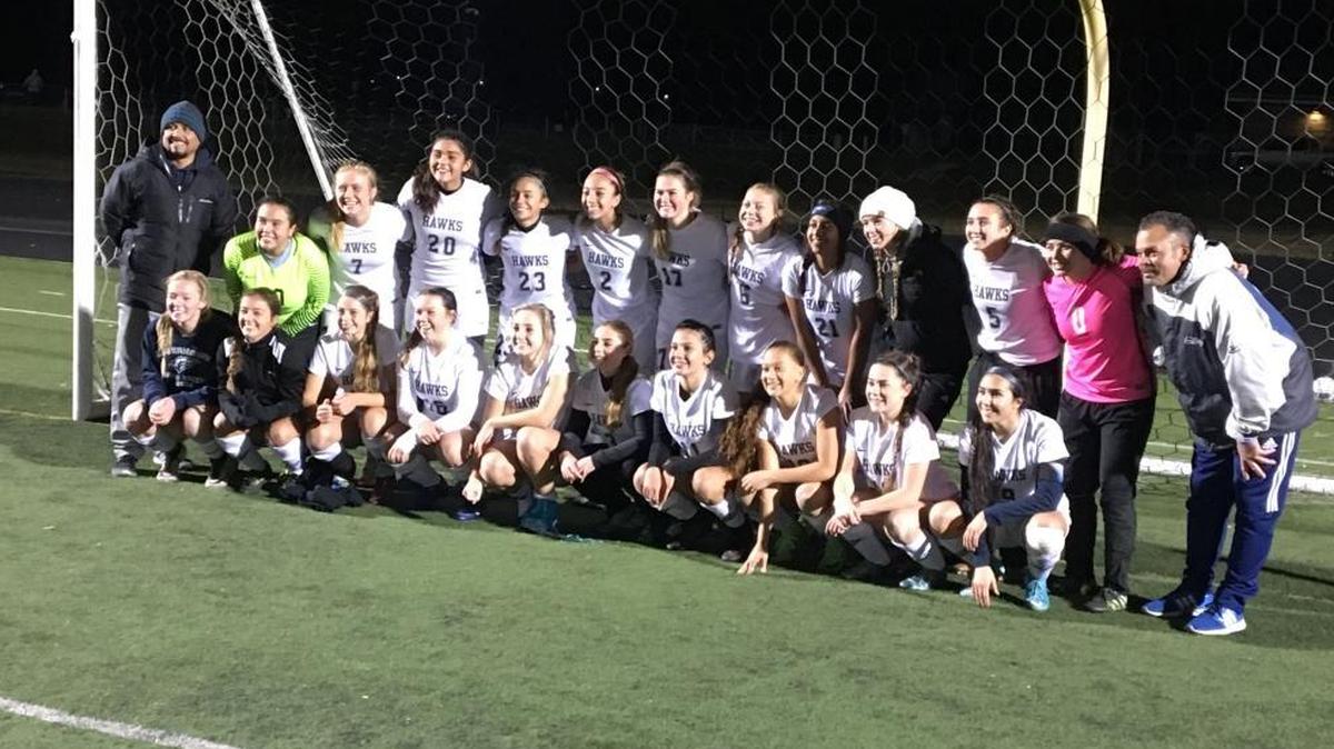 The Chiawana girls soccer team poses for a photo after beating Lewis and Clark 4-0 on Saturday at home to earn its third consecutive Class 4A state playoff berth.