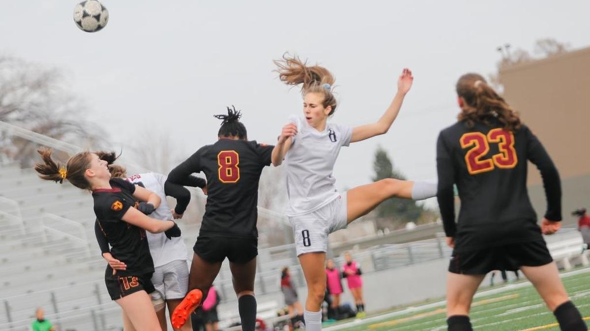 Lakeside's Kendall Titus and Kamiakin's Britney Donais battle to head the ball during a Class 3A girls soccer state quarterfinal game on Saturday at Lampson Stadium. Donais scored the game-winner in the second overtime period to lead Kamiakin to the 2-1 victory.