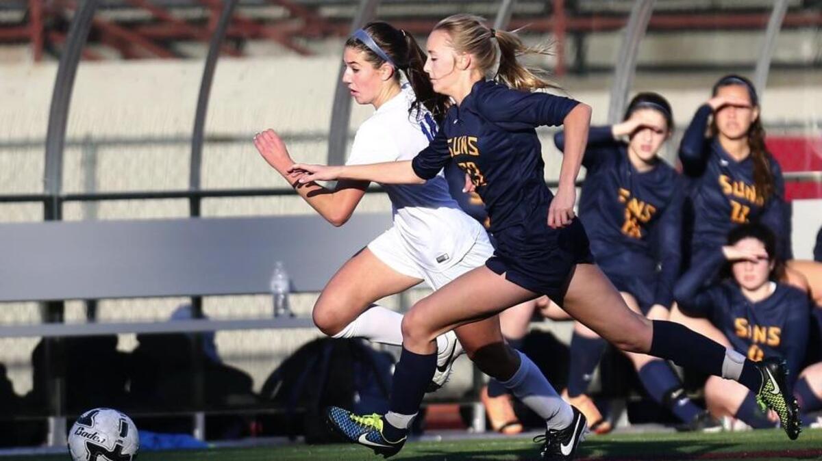 Southridge defender Kendall Pope tries to keep up with Seattle Prep midfielder/forward Sophie Hirst in the first half of Saturday’s Class 3A state soccer final at Sparks Stadium in Puyallup. Hirst scored what turned out to be the winning goal.