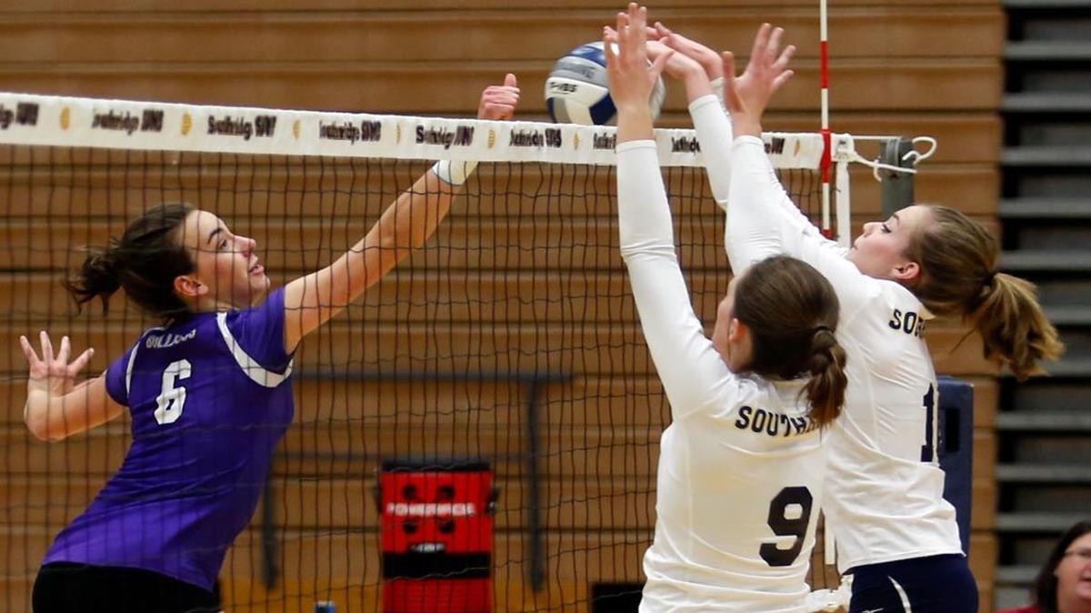 Pasco High School’s Mattie Mathews (6) can’t quite get the ball over Southridge High School’s Bobbi Newton (9) and Riley Hebdon (10) at the net Tuesday during a volleyball match at the school in Kennewick. See more photos at www.tricityherald.com.