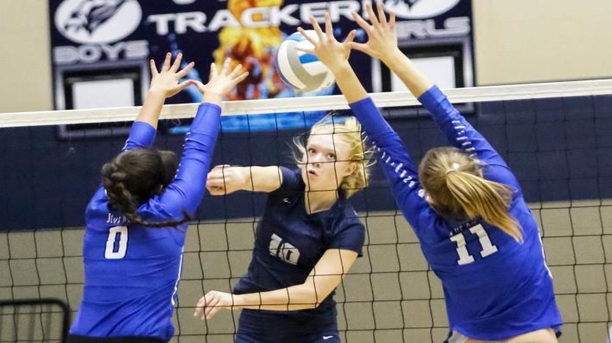 Chiawana’s Kylie Thorne (10) drives the ball between Walla Walla’s Faith Hoe (left) and Emma Wenzel (11) during Thursday’s Mid-Columbia Conference volleyball match at Chiawana High School.