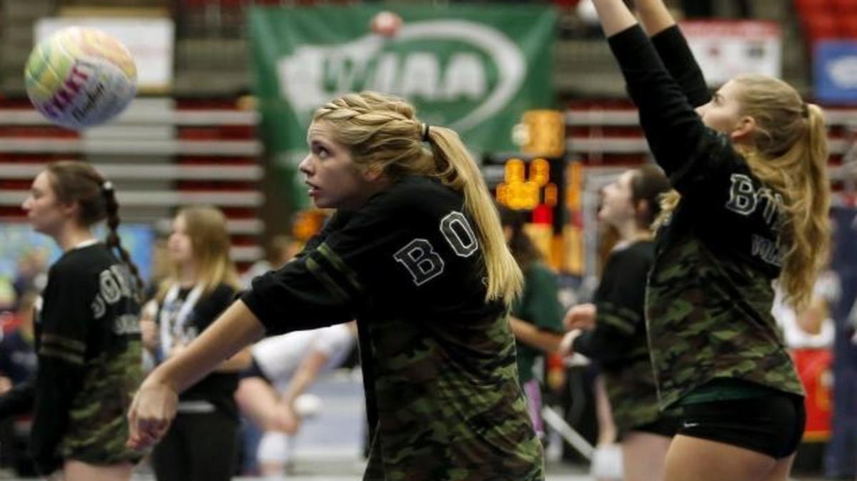 Richland High School’s Madelaine Haynie, left, hits a ball Friday during warmups for the Bombers’ Class 4A state volleyball opener against Graham-Kapowsin at Toyota Center in Kennewick.