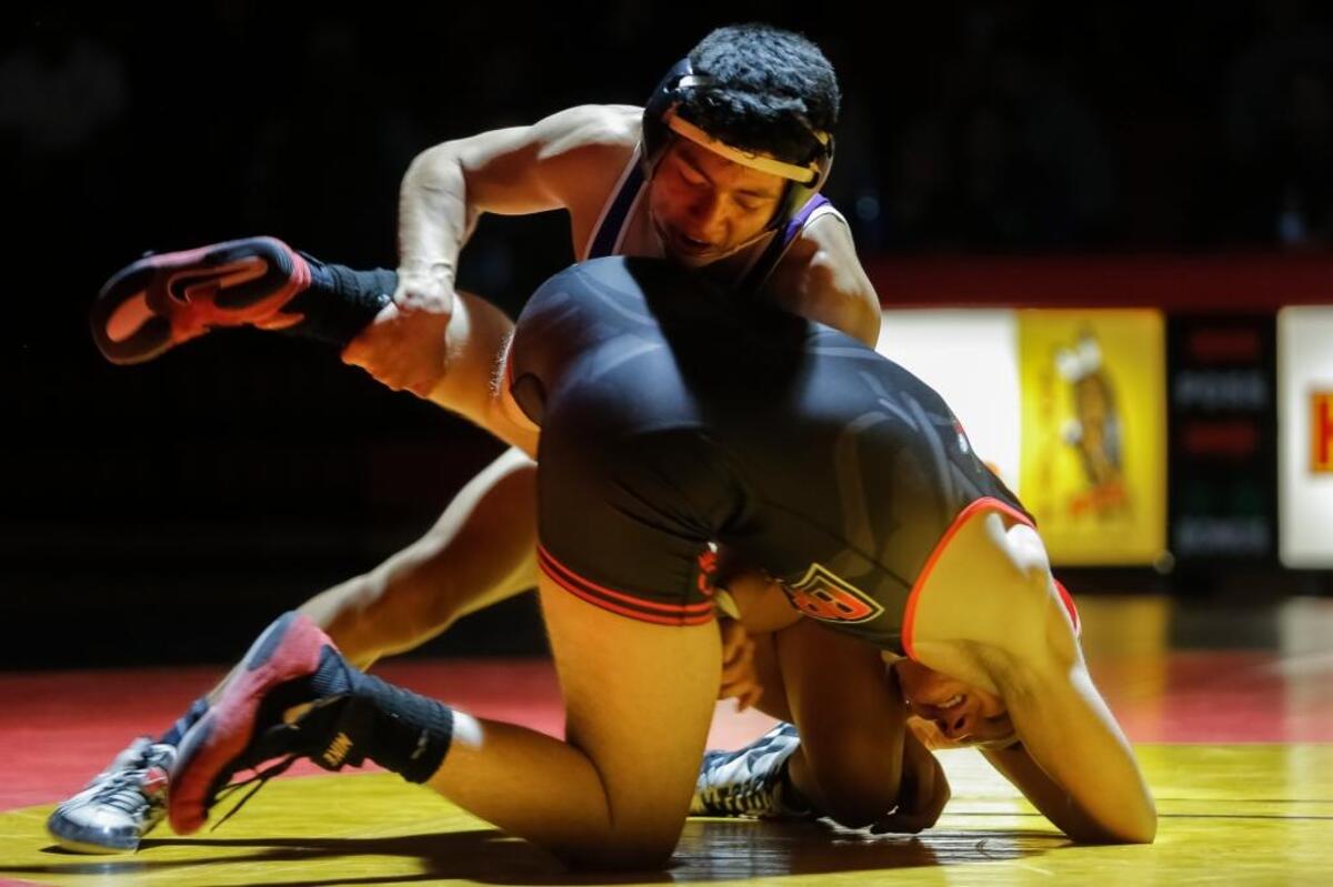 Pasco’s Jordan Renteria, top, wrestles with Kamiakin’s Michael Wheeler in a 132-pound match Thursday at Kamiakin High School. Renteria pinned Wheeler in 5:09.