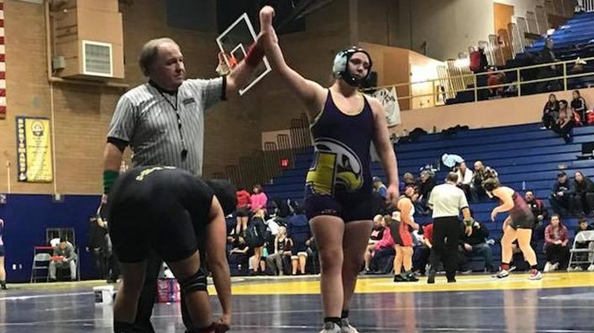Hanford’s Michaela Kane gets her hand raised after pinning Royal’s Diana Avalos in 2:58 during a consolation match at the Kelso Girls Tournament. Kane finished seventh overall at 170 pounds.