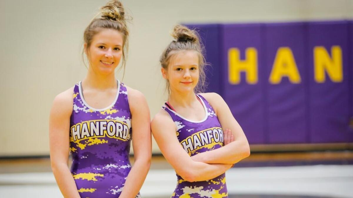 Hanford wrestlers, junior Taylor Robbins (left) and freshman Taylor Wilson pose for a photo inside the wrestling room at Hanford High School. Robbins and Wilson each won regional titles last weekend and will compete at the state tournament Friday and Saturday at the Tacoma Dome.