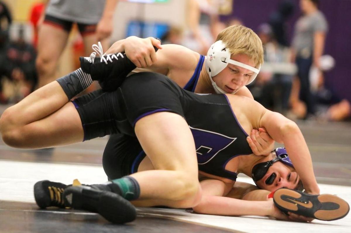 Chiawana’s Morgan McFee, top, wrestles with Pasco’s Isaiah Gonzalez in the 138-pound title match Saturday at the Hanford Winter Cup in Richland on Saturday. Gonzalez won 4-2.