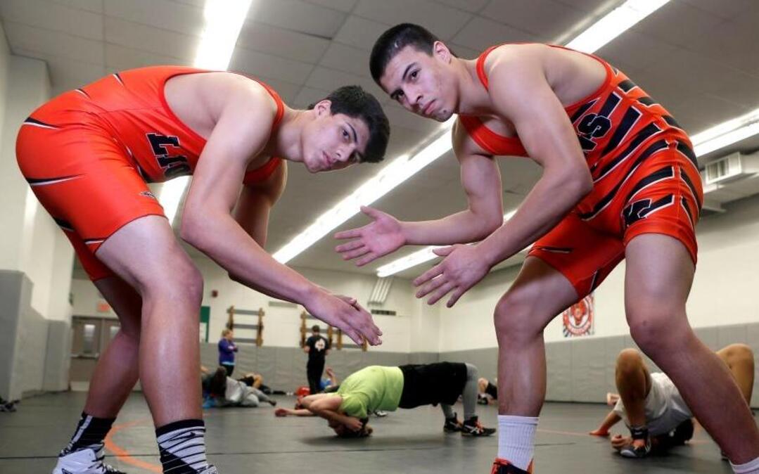 Brothers Emilio, left, a junior, and Alex Ramos, a senior, have been leading the Kennewick High School wrestling team this season. Both begin the long postseason march to the Tacoma Dome with Saturday’s district tournament.