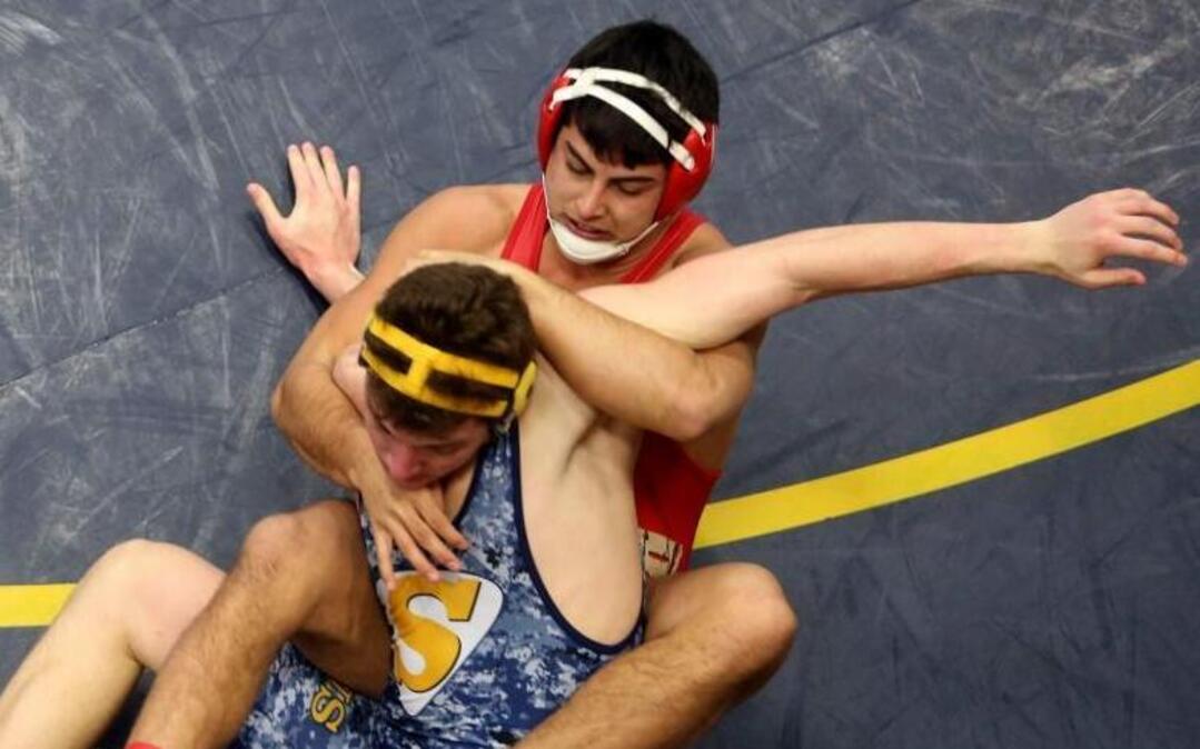 Kamiakin High School’s Zach Borisch wrestles Southridge’s Riley Lopez for first place in the 182-pound weight class during Saturday’s Mid-Columbia Conference Class 3A boys district tournament at Southridge High School.