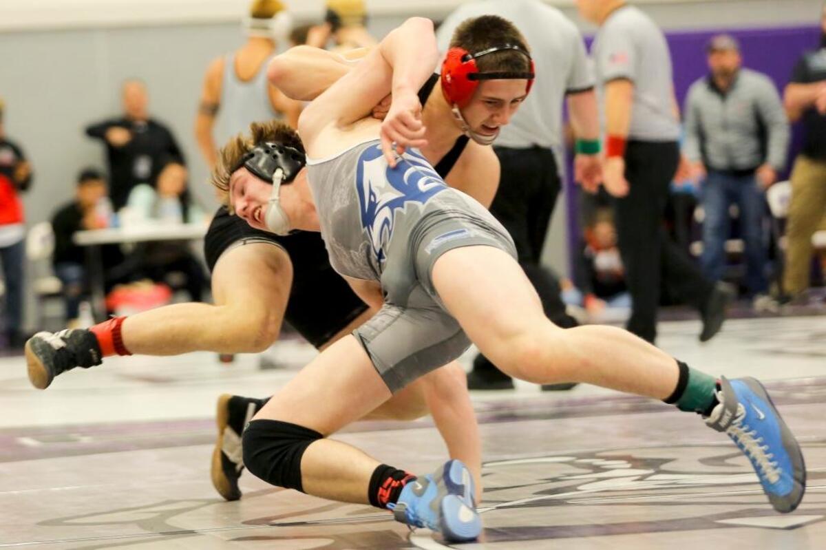 Chiawana’s Tyson Stover tries to shoot on Camas’ Gideon Malychewski in their 160-pound championship match at the 4A Region 4 Tournament on Saturday at Pasco High School. Malychewski won 5-2.