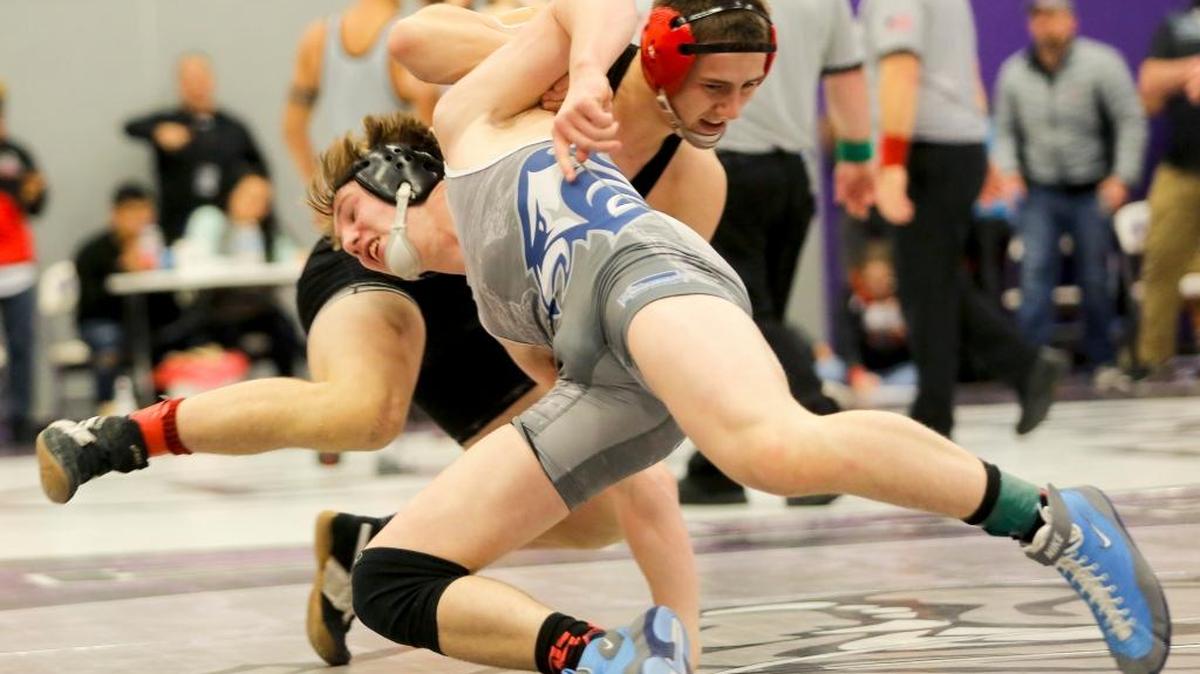 Chiawana’s Tyson Stover won an individual title last week. Here he tries to shoot on Camas’ Gideon Malychewski in their 160-pound championship match at the 4A Region 4 Tournament last season.