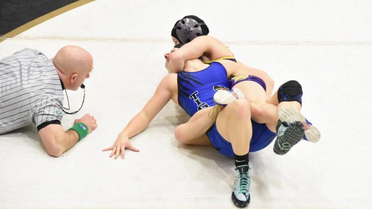 Hanford’s Taylor Wilson (top) pins Tonasket’s Mandi Wilson in 2:38 Friday in the semifinals of the Winter Cup at Hanford High School.