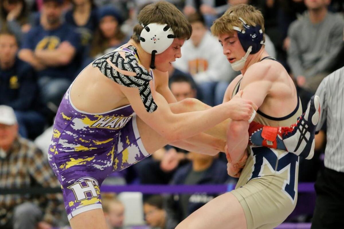 Mead’s Ben Voightleander has control of Hanford’s Hayden Henry’s left leg during their 182-pound championship match at the 4A Region 4 Tournament on Saturday at Pasco High School. Voightleander won 7-3.