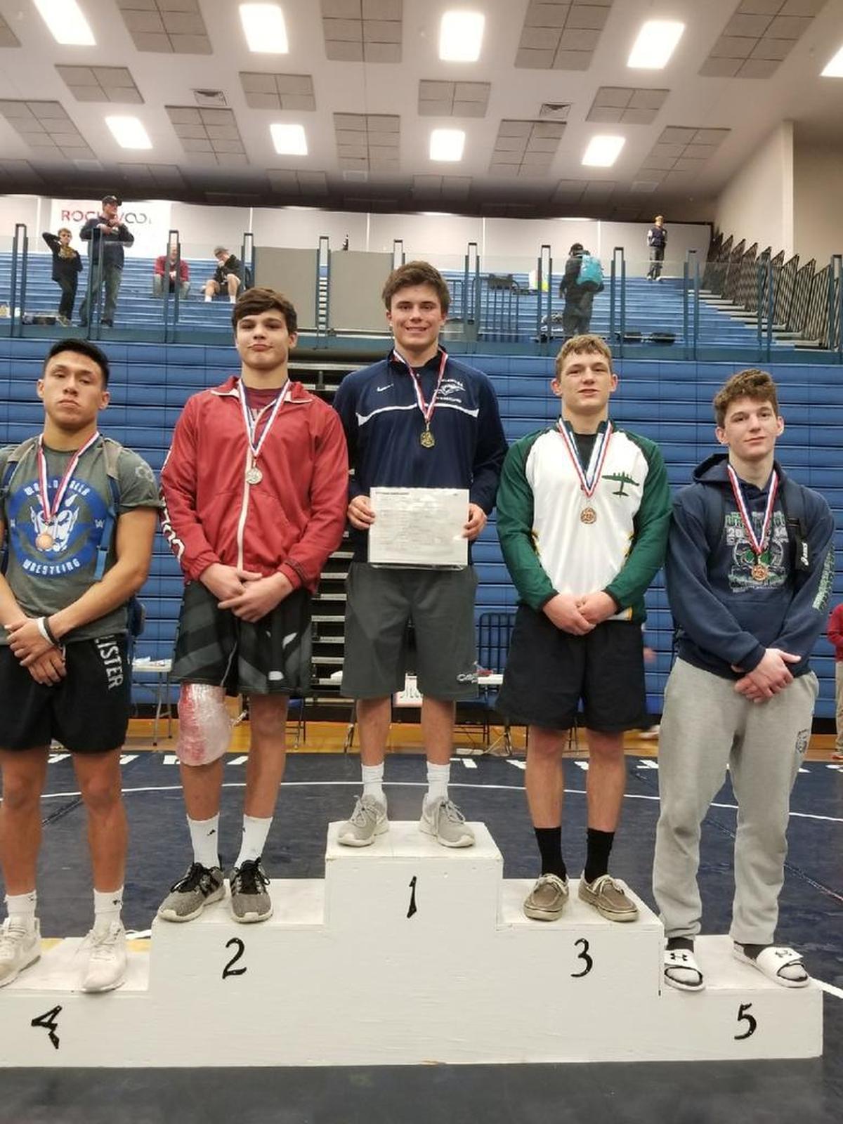 Chiawana’s Riley Cissne (center)won the 152-pound title Saturday at the Inland Empire Classic in Spokane. Richland’s Patrick Workman (second from right) was third.