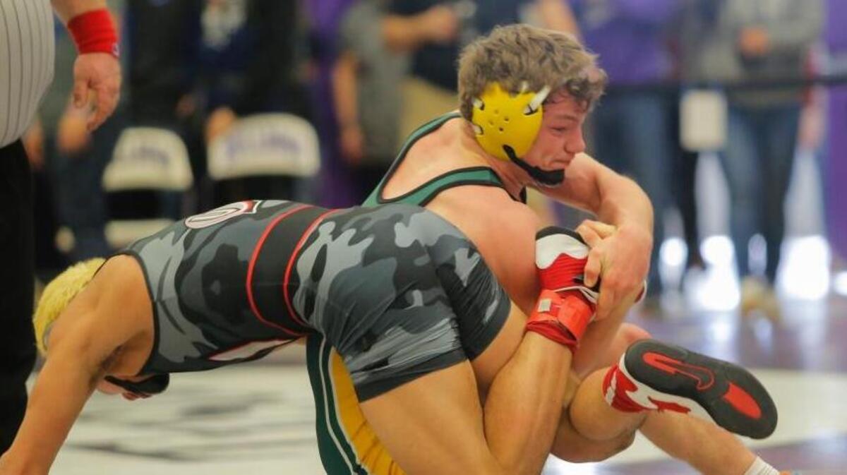 Richland’s Patrick Workman, right, wrestles with Danny Snediker of Union in their 152-pound championship match at the 4A Region 4 Tournament on Saturday at Pasco High School. Snediker won 13-5.