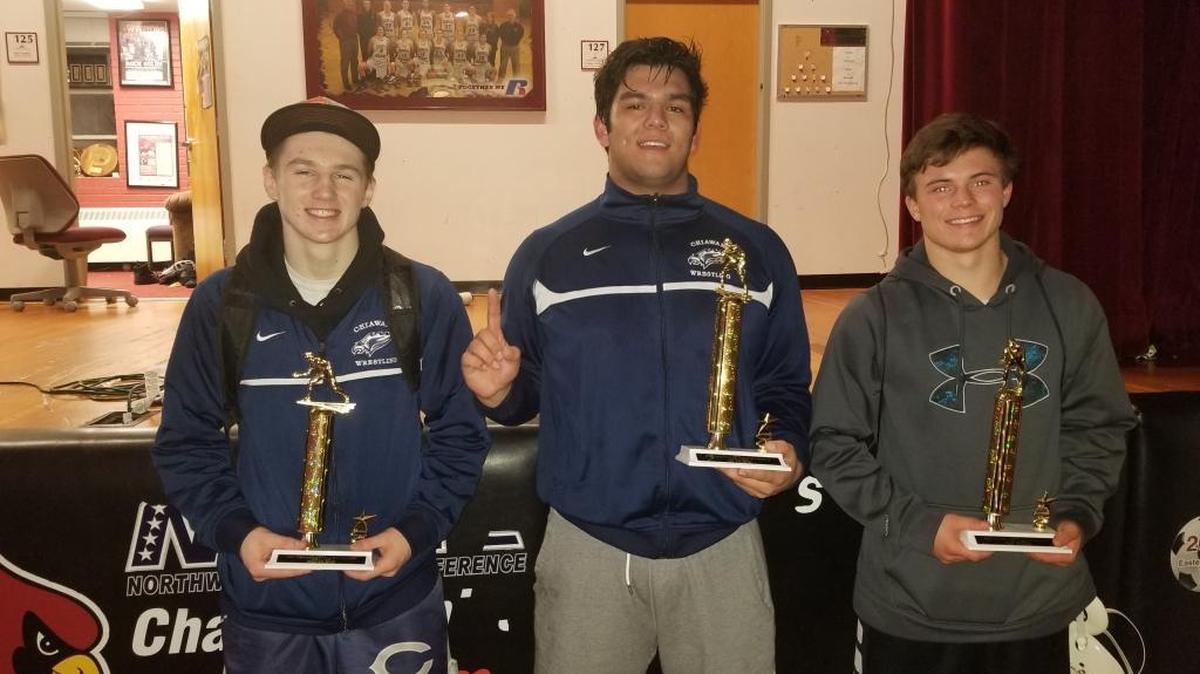 (From left to right) Chiawana’s Tyson Stover (160-pound runner-up), Josh Alvarez (285 champ) and Riley Cissne (145 runner-up) pose with their trophies after strong performances at the Tri-State wrestling tournament Saturday at North Idaho Community College in Coeur d’Alene. Alvarez was the Riverhawks’ first champion at the event.