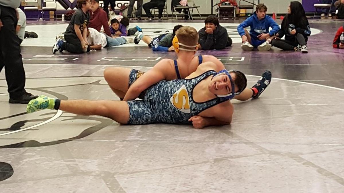 Southridge’s Atsamaz Pliev gets tangled up with Travis Mitchell of Caldwell, Idaho, in the 220-pound championship match at the Best of the West tournament in Pasco. Mitchell pinned Pliev in 5:15.