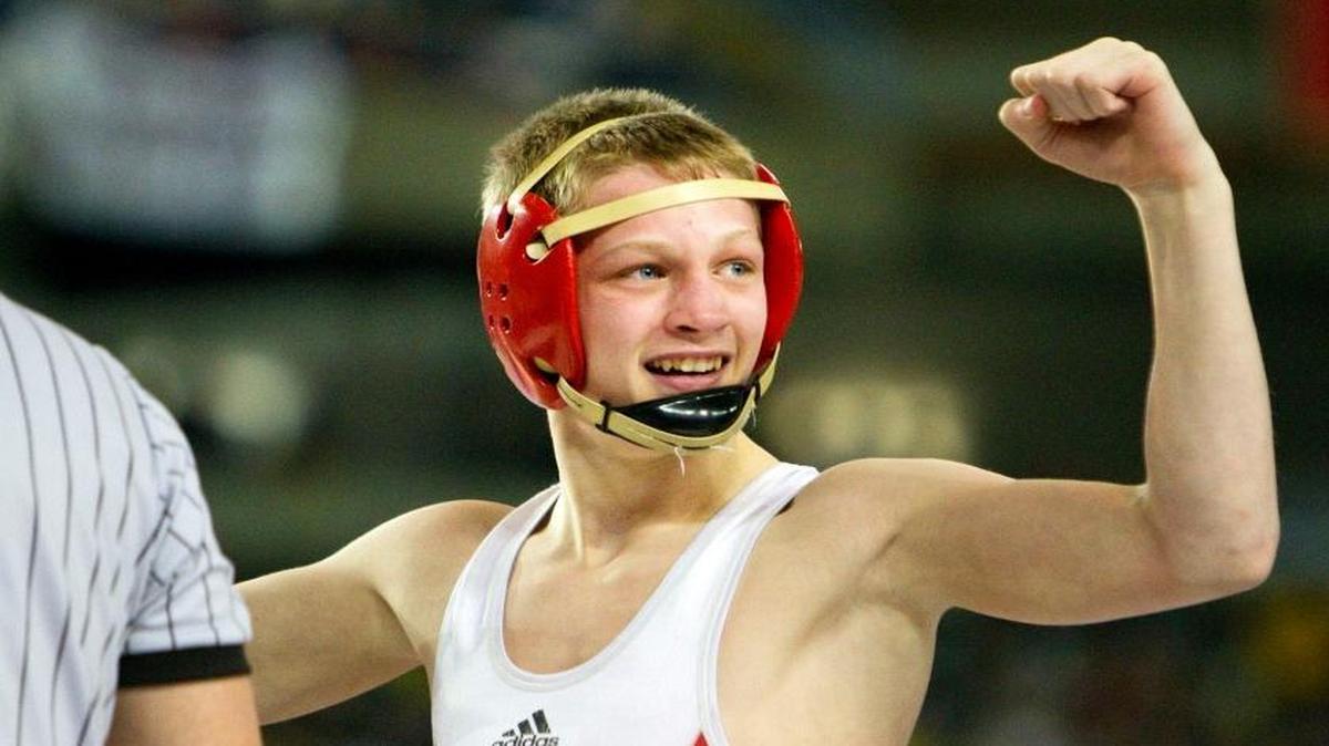 Kamiakin’s Riley Gurr salutes his fans after pinning North Central’s Clayton Gilliam in their Class 3A 113-pound title match at Mat Classic in Tacoma on Saturday. Gurr, a sophomore, finished a perfect 45-0.