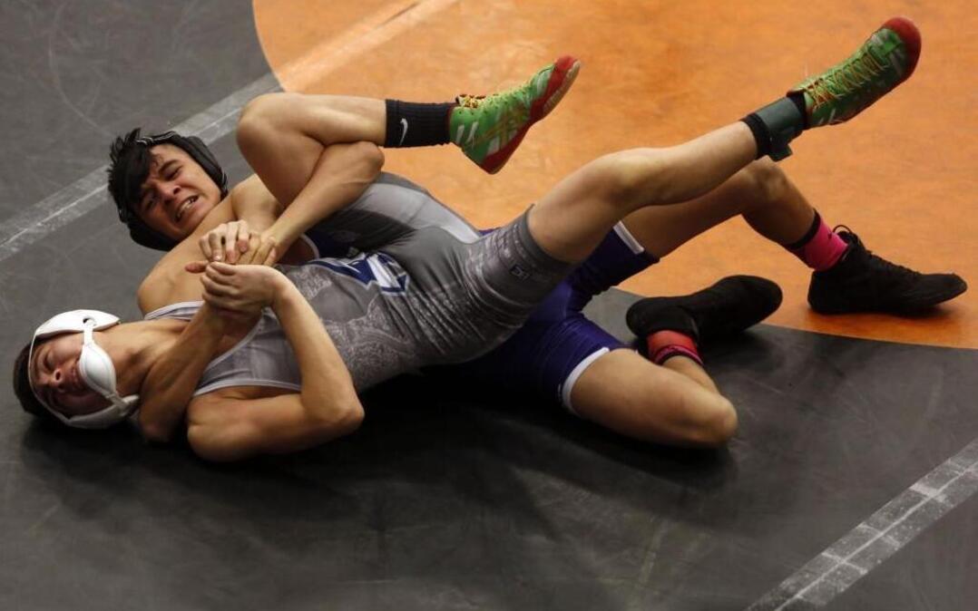 Nathan Tovar of host Pasco High School has a grip on Chiawana’s Kevin Llamas in the 106-pound championship match Thursday during the Best of the West wrestling tournament. Tovar won 11-4, but Llamas helped the Riverhawks take third in the team standings.