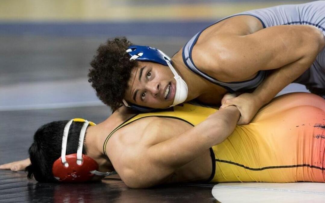 Southridge’s Zayid Al-Ghani, top, works on controlling Marysville-Pilchuck’s Keith Pablo during their Class 3A 170-pound championship match Saturday at the Tacoma Dome. Al-Ghani won 5-2 to take the title.