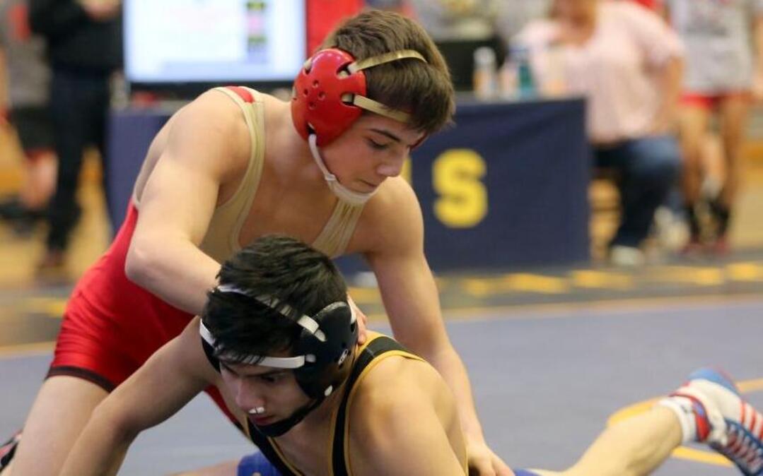 Kamiakin’s Austin Almaguer (top) picked up his second consecutive district wrestling title Saturday with a pin of Southridge’s Giovanni Penaloza at 120 pounds. Almaguer is on a quest for his first regional title this weekend.