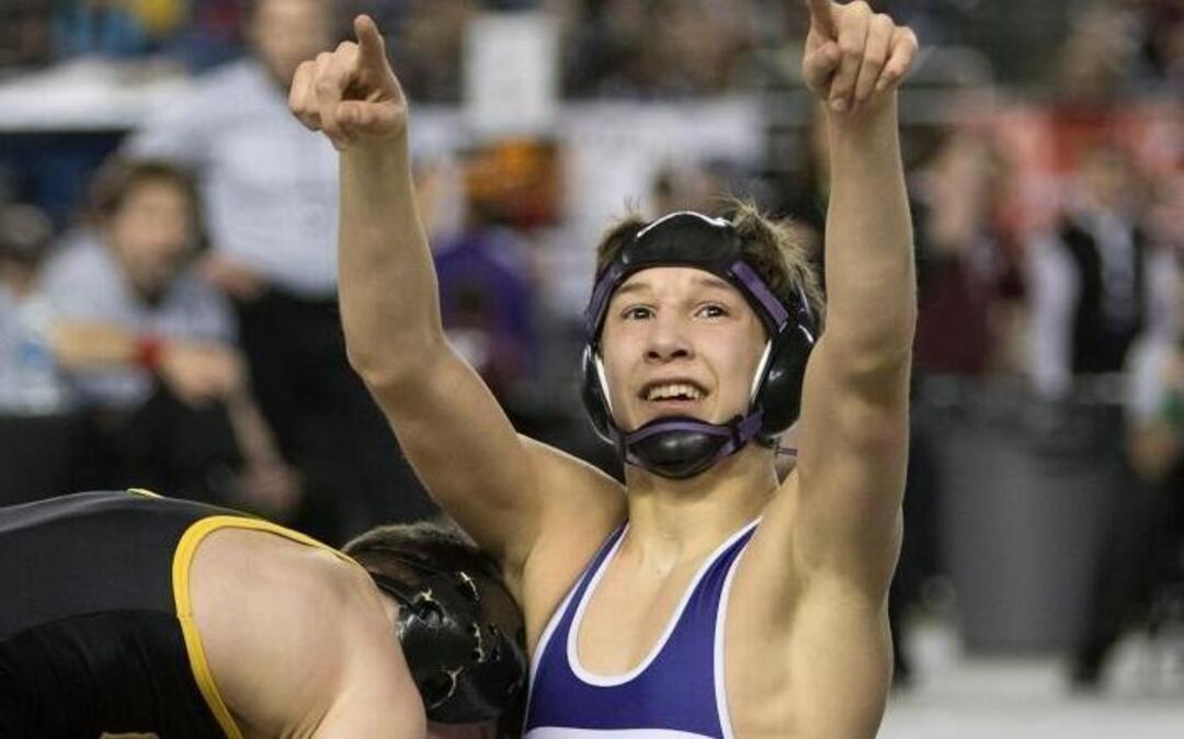 Pisco’s Isaiah Gonzalez points to his fans after defeating Tahoma’s Austin Michalski in their Class 4A 113-pound match Saturday at Mat Classic in Tacoma.