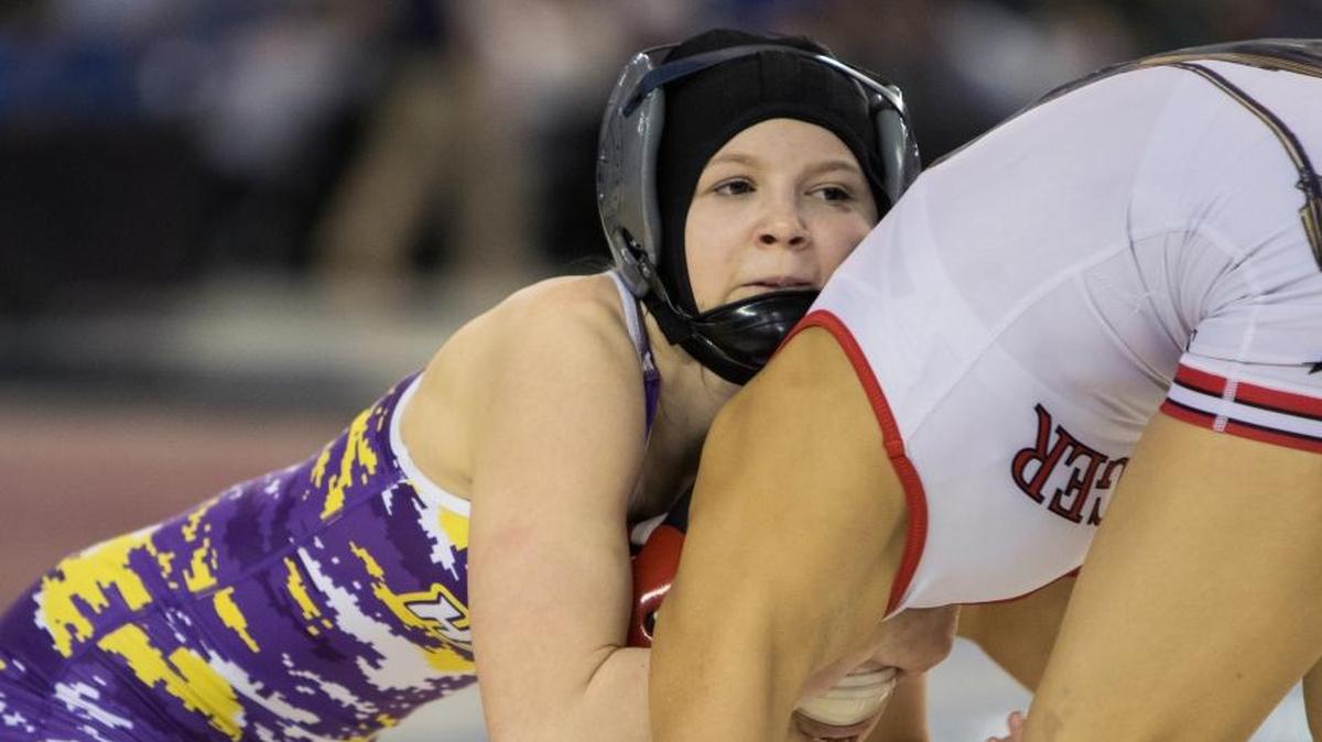 Hanford’s Taylor Wilson, left, is the two-time defending state champion at her weight class. This was last year’s 100-pound state championship match.