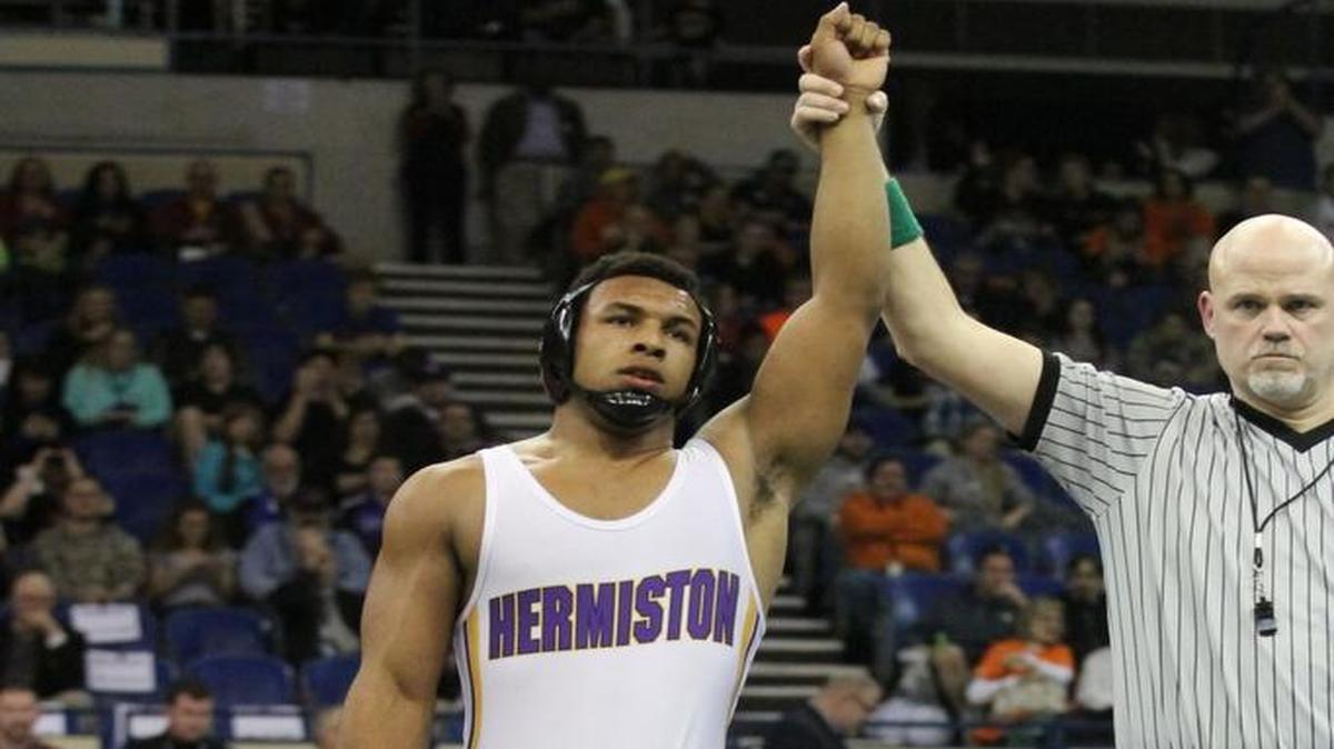 Beginning in the 2018-19 school year, Hermiston High School will be competing for state championships in the Washington Interscholastic Activities Association, after the school’s petition for membership into the WIAA, and therefore the Mid-Columbia Conference, was approved Monday. This file photo, from 2014, is of wrestler Sam Colbray winning his third straight state wrestling title as a junior.