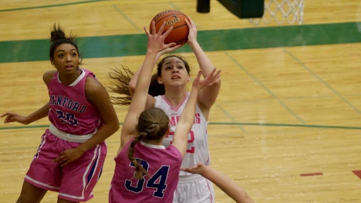 Gia Sorn (32), of host Richland High School, shoots over Hanford’s Ellie Harlow (34) on Friday night. Sorn finished with 17 points in the Bombers’ 66-45 win.