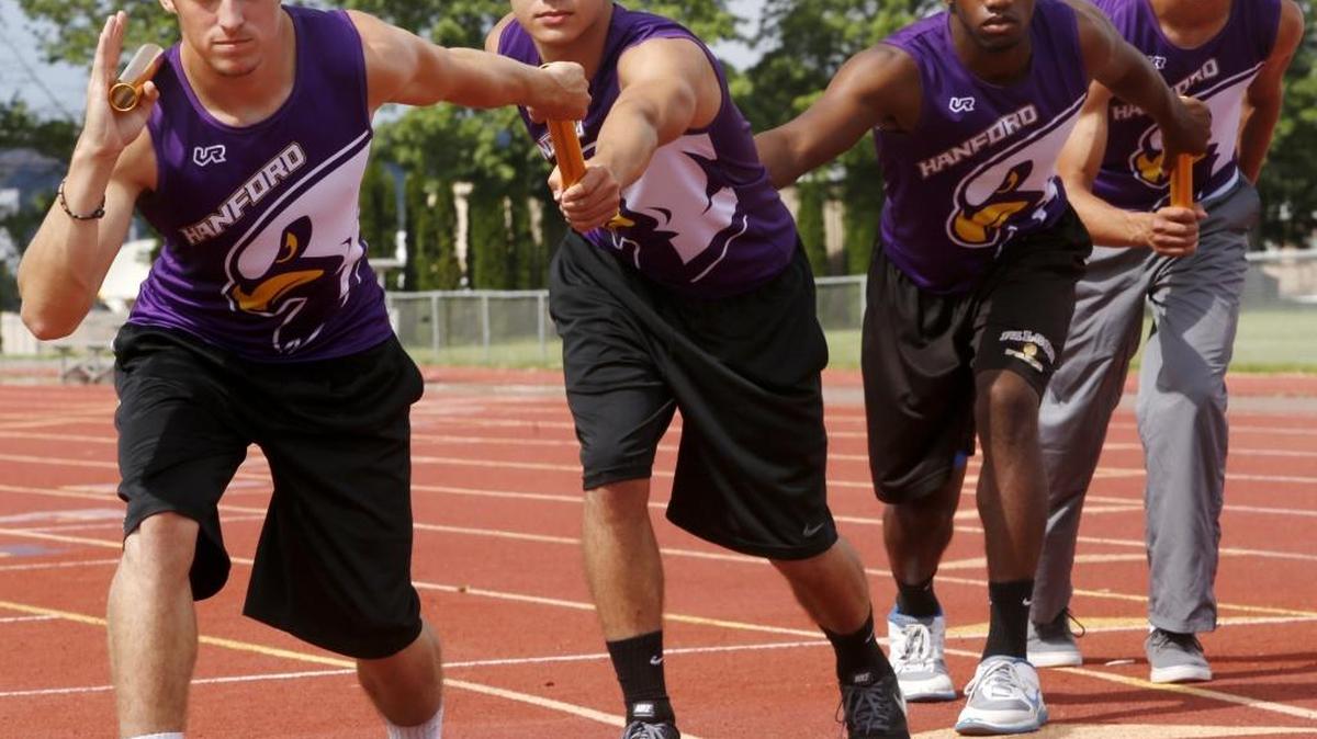 Joe Gauthier, left, and Gavin Slack, right, ran on Hanford’s 4x100-meter relay team in 2015 along with Mateo Valadez (second from left) and Kevon Skinner. The team set the school record and placed sixth at state.