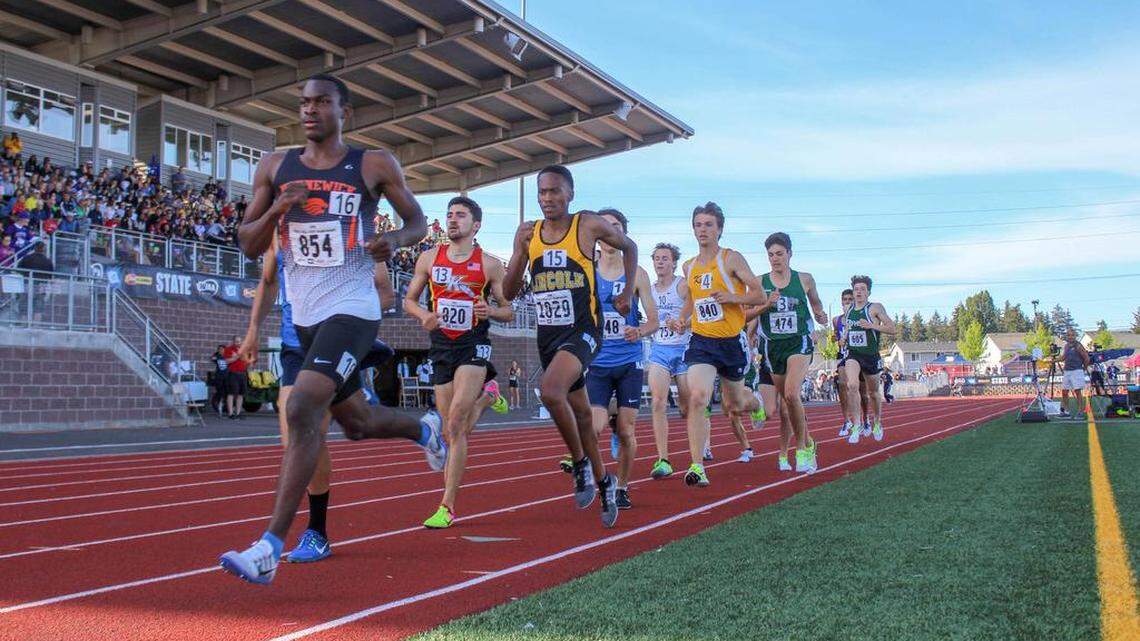 Kennewick’s Johan Correa leads the pack after the first lap of the 3A boys 1,600-meter final at the state track and field meet last season at Mt. Tahoma High School in Tacoma.