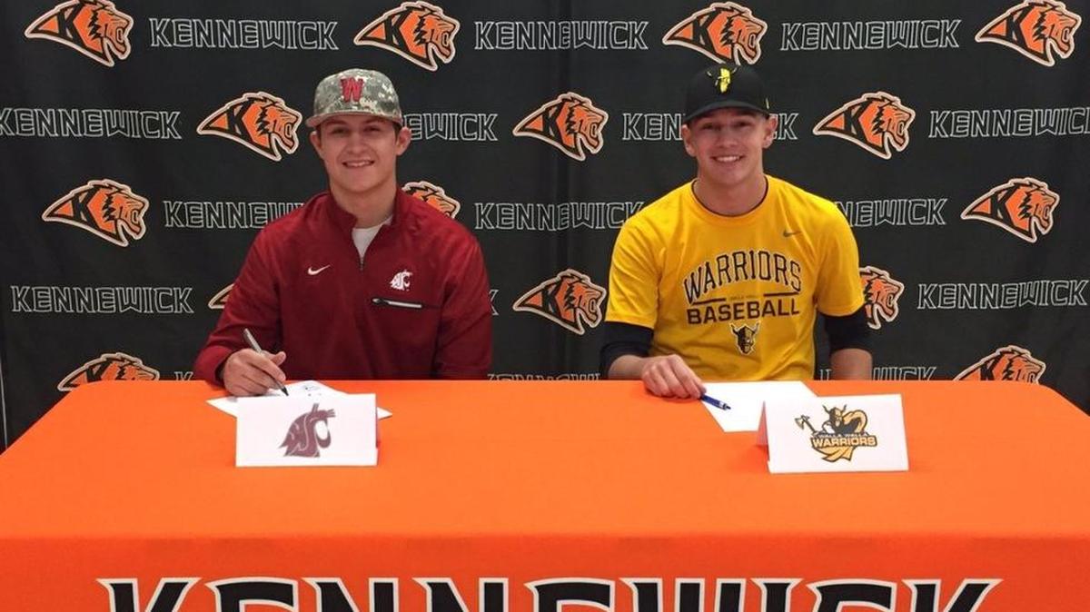 Kennewick’s Trent Sellers (Washington State), right, and Cooper Shelby (Walla Walla Community College) signed their baseball letters of intent Wednesday.
