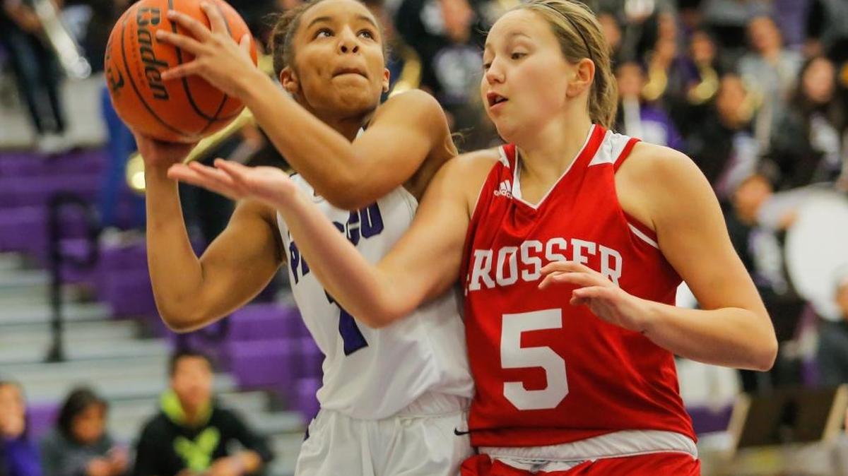 Pasco's Lyqualah Kinsey takes a shot while being pressured by Prosser's Cheyann Douglas during a girls basketball game on Tuesday that Prosser won 73-46.