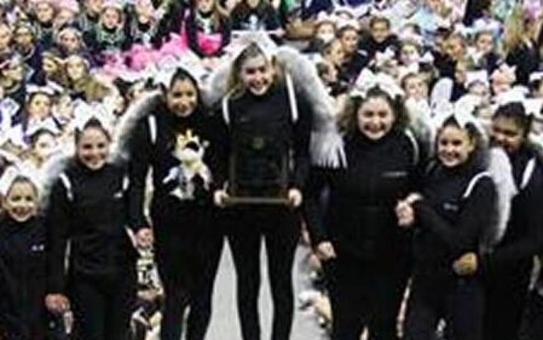 Members of Hanford High’s non-tumbling state championship team accept their trophy at the Washington State Cheer Championships on Jan. 28 in Seattle.