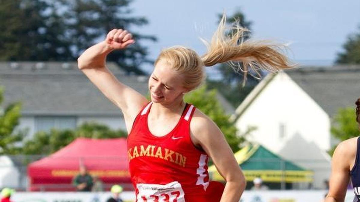 Kamiakin’s Heather Donais celebrates as she crosses the finish line in first place in the Class 3A girls 100-meter hurdles Friday at the state track and field championships in Tacoma.