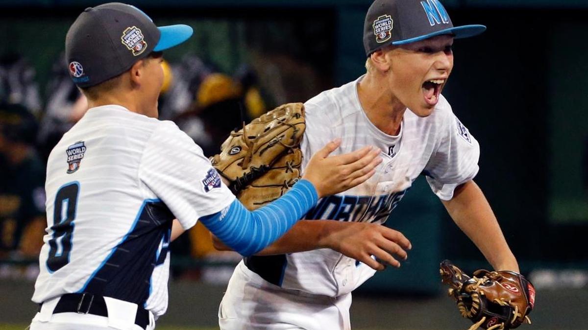 Walla Walla pitcher Drew Hill, right, celebrates with Hayden Lomeli (8) after getting the final out of a 4-3 win Saturday over Sioux Falls, S.D., in an elimination game at the Little League World Series in South Williamsport, Pa.