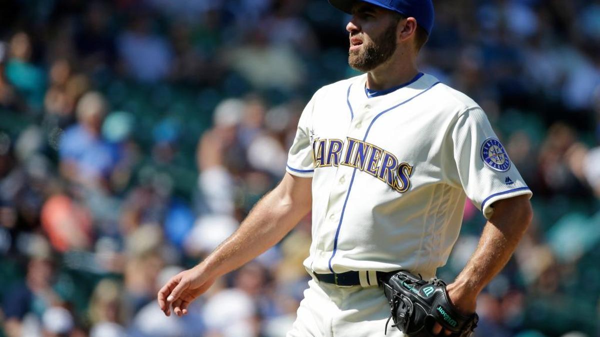 Seattle Mariners pitcher Nathan Karns reacts after giving up a grand slam to Houston’s Carlos Gomez in the seventh inning Sunday in Seattle.