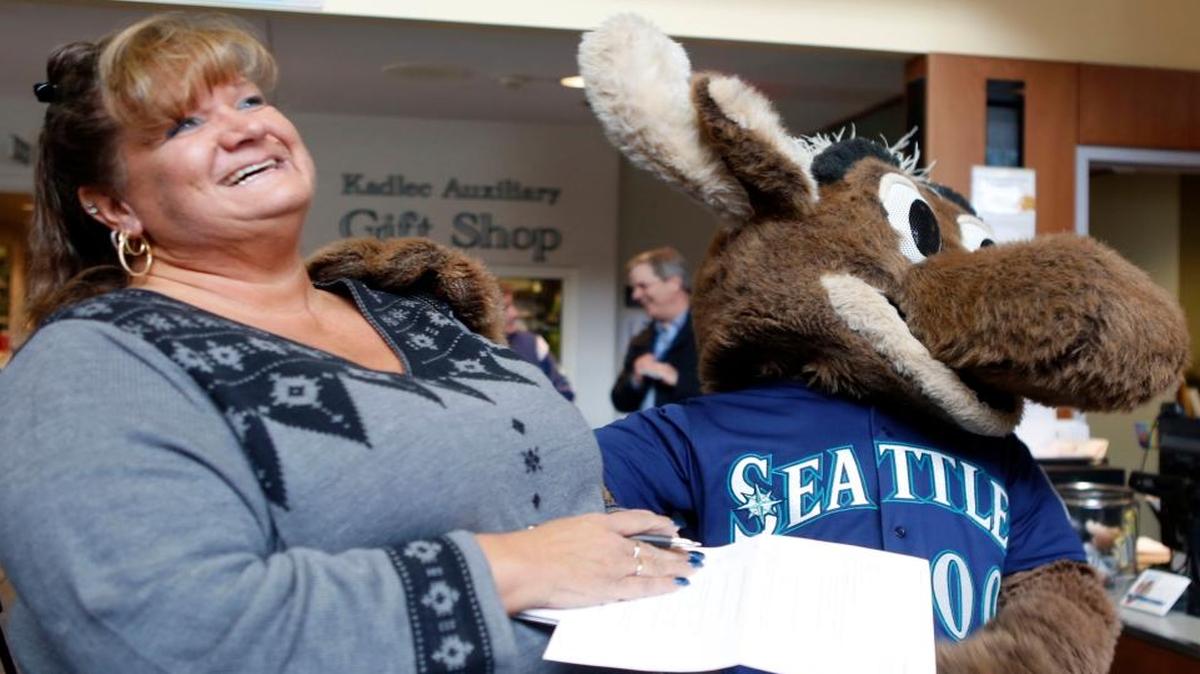 The Mariner Moose answers questions from Tri-City Herald sports reporter Annie Fowler during a stop Friday during the Seattle Mariners Caravan at Kadlec Regional Medical Center in Richland.