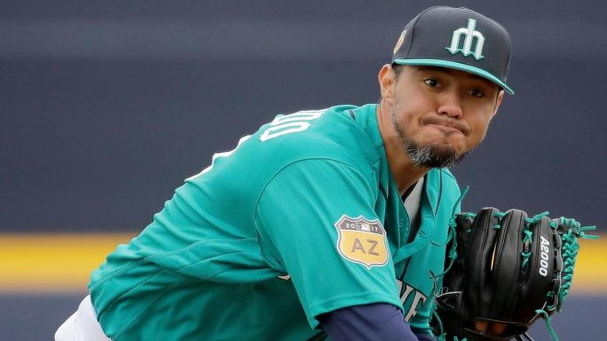 Seattle Mariners starting pitcher Yovani Gallardo throws during the first inning of a spring training game against the Kansas City Royals on Monday in Peoria, Ariz.