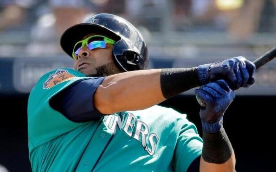 Seattle Mariners’ Nelson Cruz watches his solo home run during the second inning of a spring training baseball game against the San Diego Padres on Sunday.