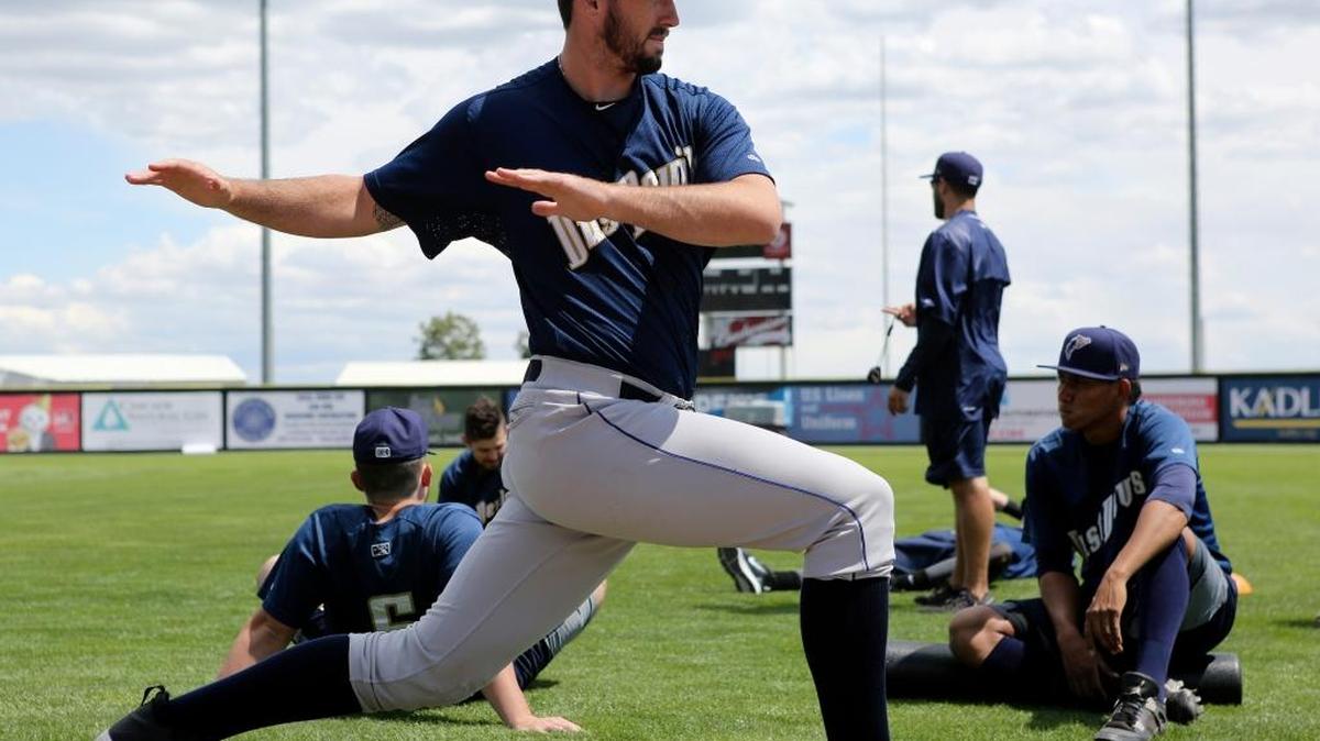 Tri-City Dust Devils pitcher Dalton Erb warms up during practice Thursday at Gesa Stadium in Pasco.