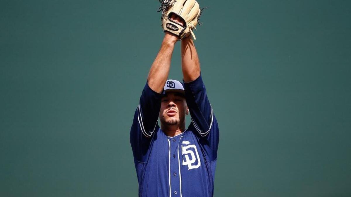 Former Tri-City Dust Devils pitcher Joey Lucchesi, starting his windup during a San Diego Padres spring training game March 22, is scheduled to make his major league debut Friday as the Padres starter.