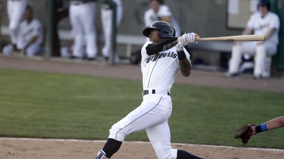 Tri-City Dust Devils center fielder Buddy Reed swings during an at-bat earlier this season against the Eugene Emeralds at Gesa Stadium. Reed is a five-tool player who built up his athleticism playing baseball, hockey and soccer.