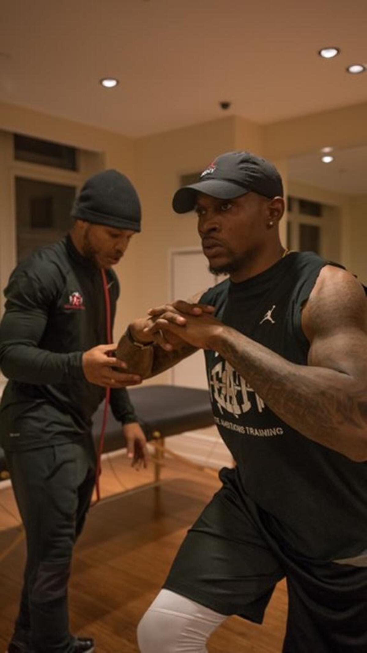 Steven Whitehead, left, works with Philadelphia Eagle receiver Alshon Jeffery.