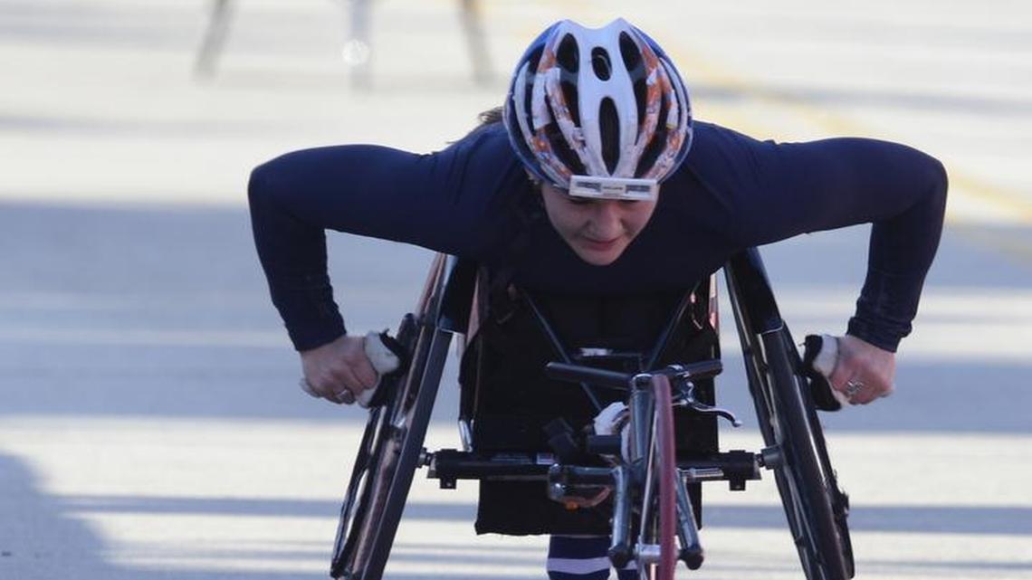 Chelsea McClammer of the United States finishes third in the women’s wheelchair race in the Bank of America Chicago Marathon, Sunday, Oct. 11, 2015, in Chicago.