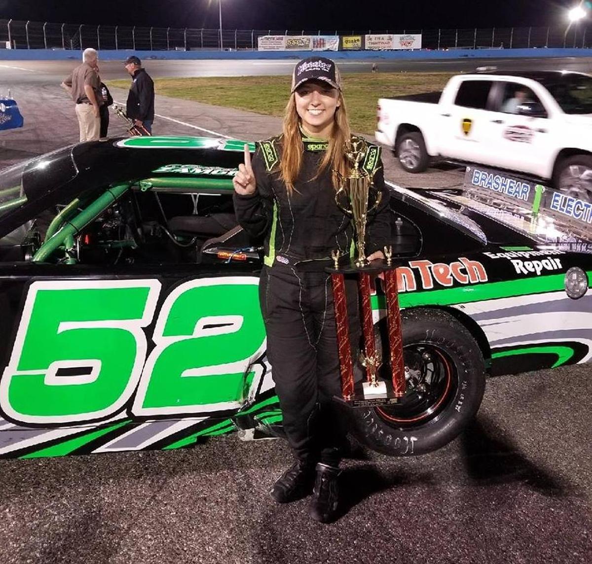 Brittney Zamora of Kennewick poses with her car and trophy Sept. 23 after winning the Neal Newberry 125 in Wenatchee and the Northwest Super Late Model Series points title.