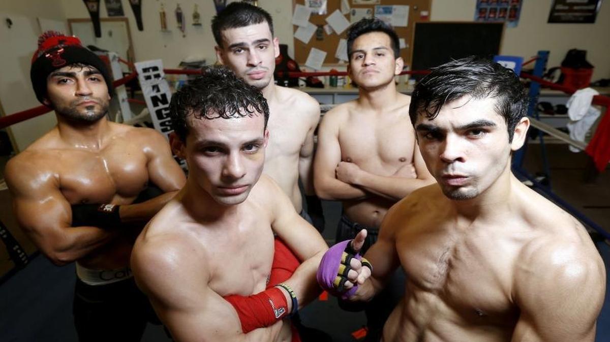 Boxers with R&C Boxing Club, front from right, Luee Alvarado, Jeremy Morales, back from right, Eric Mendoza, Alexis Vega and Arturo Uriostegui pose for a photo at the club’s gym in Kennewick. The club will send the five boxers to the state Golden Gloves tournament this weekend in Tacoma.