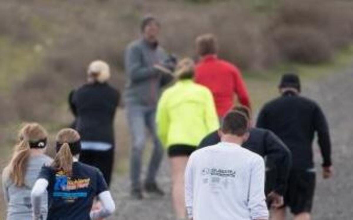 Runners start up the hill from the Dallas Road checkpoint, marking the half-way point of the Badger Mountain Challenge 15K race.