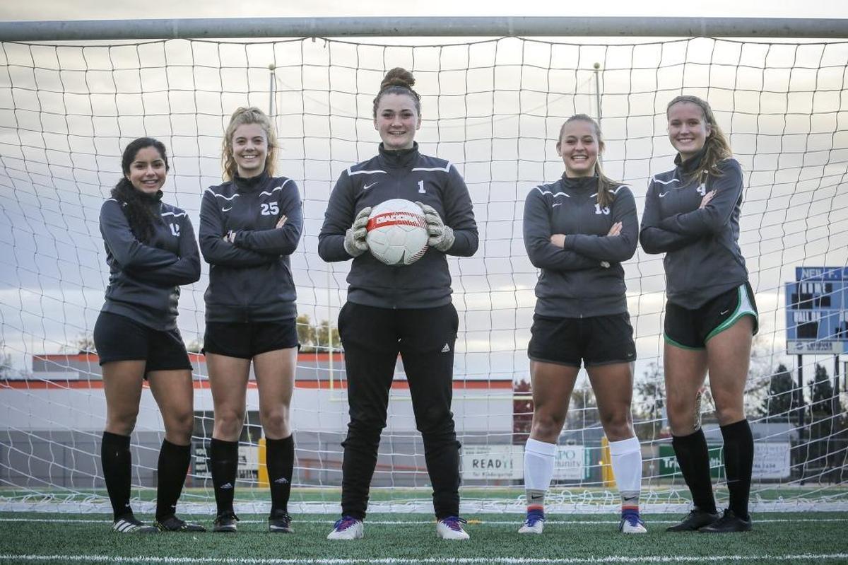 Kamiakin's defense, from the left, Bela Nicacio, Rylie Clark, Grace Wilbur, Kaylee Kraft and Emma Johnson pose for a photo at Lampson Stadium in Kennewick. Kamiakin remains undefeated.