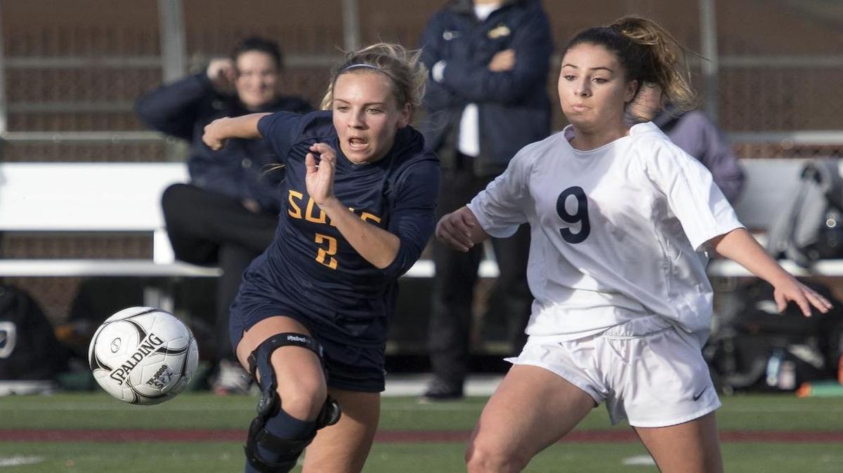 Southridge’s McKaley Goffard, left, dashes toward the ball and past Bellevue’s Catie Buck on Nov. 19, 2016, during the Class 3A girls state soccer championship game in Puyallup. Bellevue won 1-0, and Southridge took second for the third consecutive season.