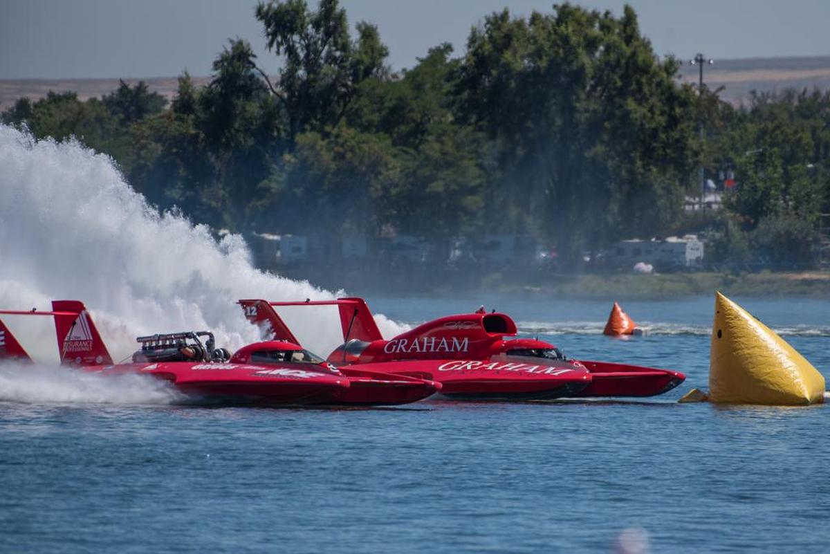 The U-3 Grigg’s Hardware/Ace Hardware the U-12 Graham Trucking come out of turn 2 neck and neck during heat 4A on Sunday.